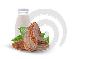 Almonds with green leaves with almond milk