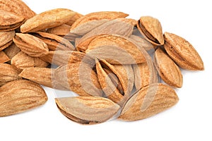 Almonds heap isolated on white background. Panorama of unpeeled closeup. Nuts collection