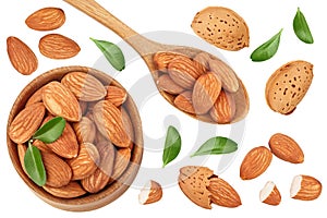 Almonds nuts in wooden bowl with leaves isolated on white background. Top view. Flat lay
