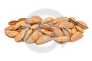 Almonds pile isolated on white background. Heap of almonds unpeeled kernels close-up. Nuts collection