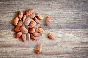 Almonds on rustic wooden background top view - Close up almond nuts natural protein food and for snack