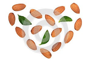 Almonds in the shape of a heart with leaves isolated on white background. Top view. Flat lay pattern