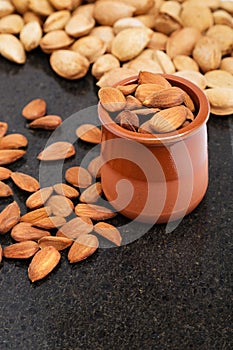 Almonds in a vessel, snacks of nuts