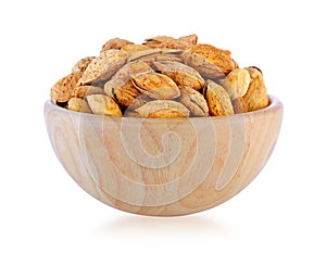 Almonds in wood bowl isolated