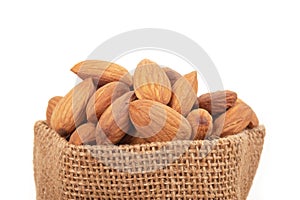 Almonds on wooden background. Healty food concept