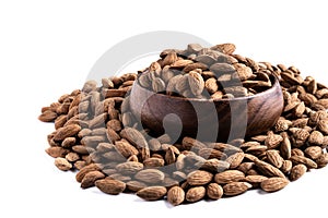 Almonds in wooden bowl isolated on white