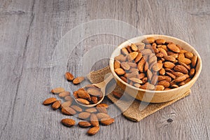 closed up of almonds on wooden table photo