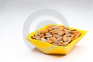 Almonds in yellow bowl