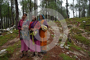 ALMORA, INDIA - SEPTEMBER 06, 2020: Portrait of three village women, standing with each other, wearing traditional clothes