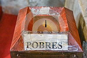 Alms box in the Portuguese Catholic church with the written mention, & x22;POBRES& x22; photo