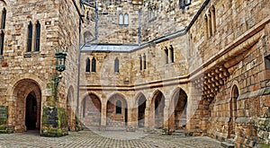 Alnwick Castle. The courtyard of the old castle with arches.