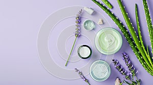 Aloe skincare products, delicate containers set with aloe vera leaves on a pastel lavender background, copy space