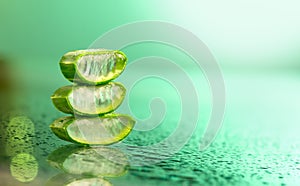 Aloe Vera closeup. Slices of Aloevera leaf plant gel, natural organic renewal cosmetics, alternative medicine. Skin care