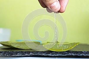 Aloe Vera gel dripping from hands