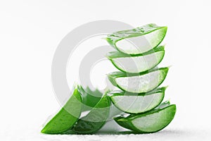 Aloe vera leaf slices with gel on white background. photo