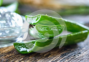 Aloe Vera leaves on wooden background