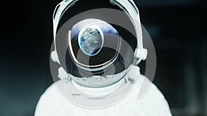 Alone astronaut in futuristic space corridor, room. view of the earth. cinematic 4k footage.