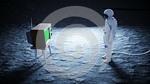 Alone astronaut on the moon watch old TV. Tracking your content. Ralistic 4K animation.