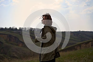 Alone beautiful girl on mountain landscape feeling lonely, isolated