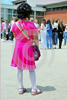 Alone girl in front of the school