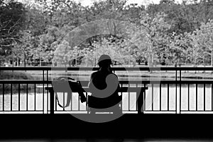 Alone girl sit in the park.