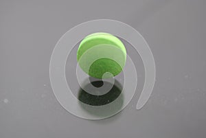 Alone green round tablet