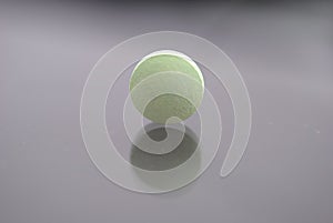 Alone light green round tablet