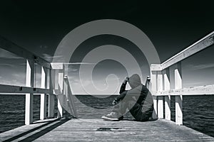 Alone Man at the Edge of Wooden Pier