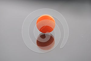 Alone orange round tablet
