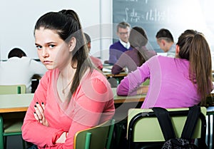 Alone outcasted student being mobbed by other students