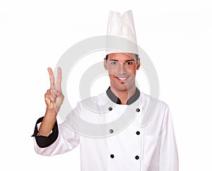 Alone professional chef with victory sign