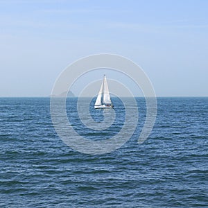 Alone sailboat is sailing