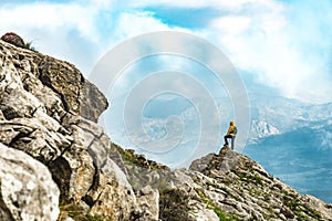 Alone at the summit climber and avid landscape