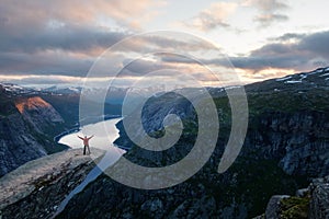 Alone tourist on Trolltunga rock photo