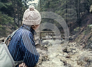 Alone traveler in spring mountain forest