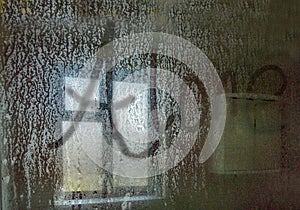 Alone written on a shower screen