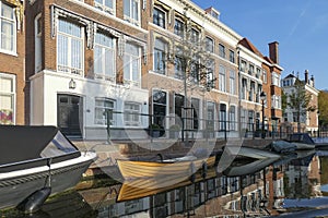 Along the Hooigracht in The Hague there are beautiful houses and many boats, some of which have partly sunk, along the quay