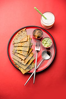 Aloo Paratha / Indian Potato stuffed Flatbread. Served with fresh fresh Lassi / Lassie or buttermilk