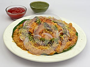 Aloo tikki chaat Indian street food served with chole photo