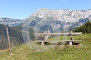 Alp with bench for hikers in mountains near German Berchtesgaden