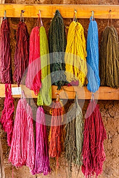 Colourful Alpaca Wool, drying on the wall, Peru