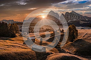 Alpe di Siusi, Italy - Aerial panoramic view of wooden cottages at Seiser Alm, a Dolomite plateau in South Tyrol in the Dolomites