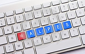ALPES writing on white keyboard with a snowflake sketch