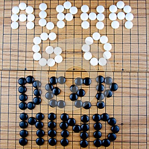 Alpha GO Deep Mind Lettering on the famous Asian Go Board Game in black and white