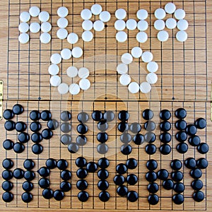 Alpha GO Sputnik Moment Lettering on the famous Asian Go Board Game in black and white
