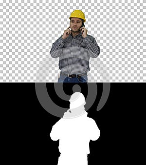 Construction worker using smartphone, Alpha Channel