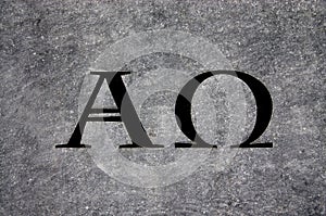 Alpha and Omega in stone photo