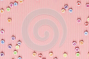 Alphabet beads border pink wallpaper background text space