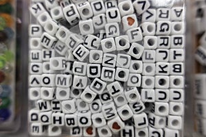Alphabet beads used for arts and crafts in a bag