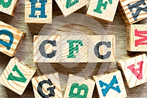 Alphabet block in word CFC abbreviation of Chlorofluorocarbon with another on wood background